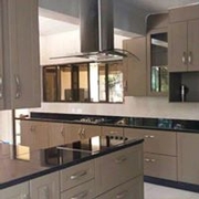 Fitted Kitchen with Wrapped Wood + Galaxy Black Granite Countertop