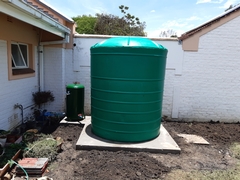 After concrete has cured mounting and connecting tank
