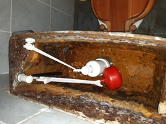 Removal of old rusty toilet cisterns